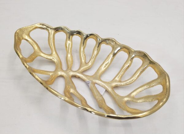 Decorative gold-colored metal bowl with an openwork design